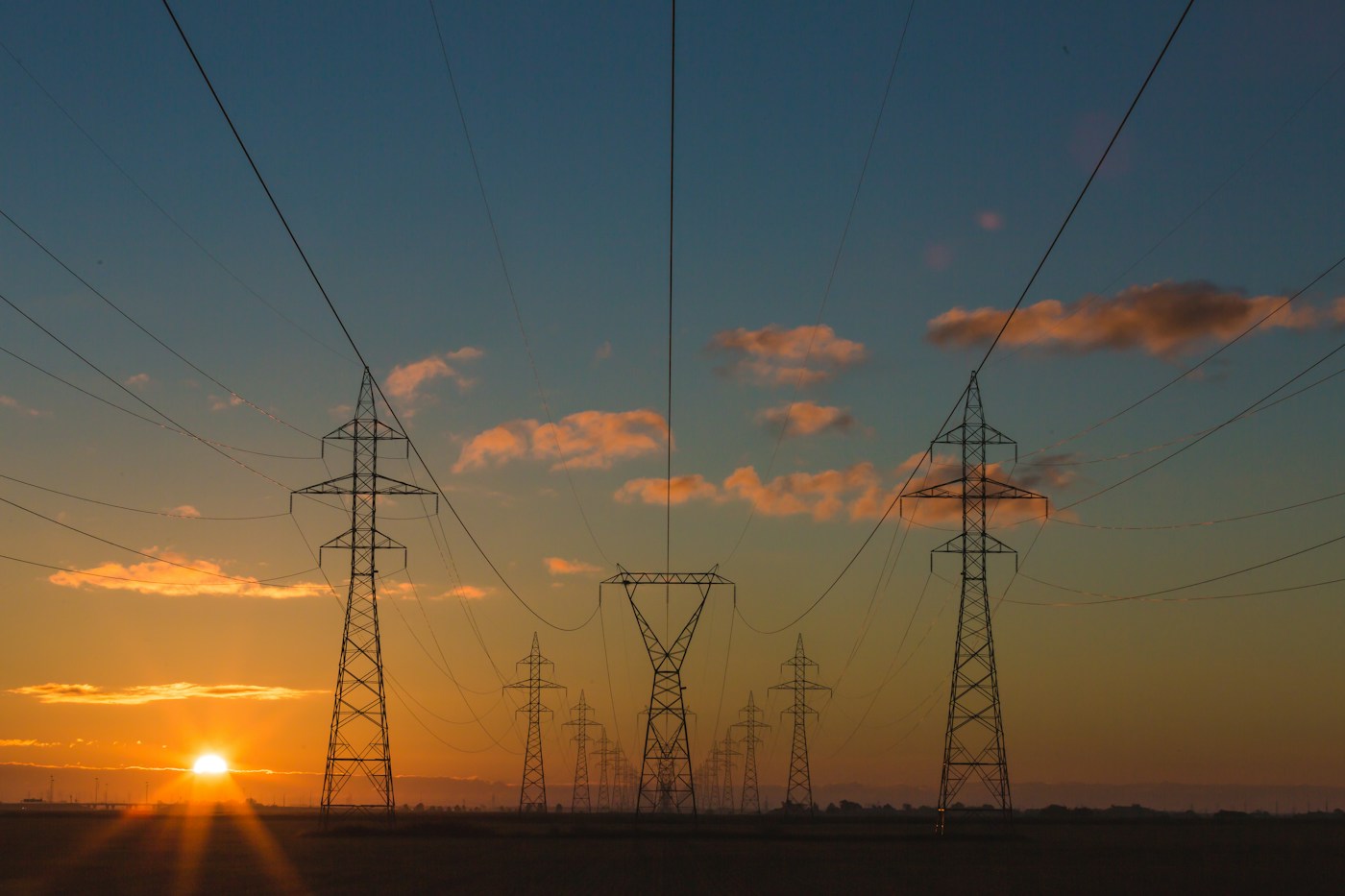 Electricity transmission lines at sunset